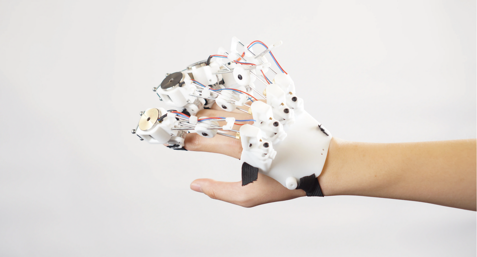 Hand with haptics technology on display.