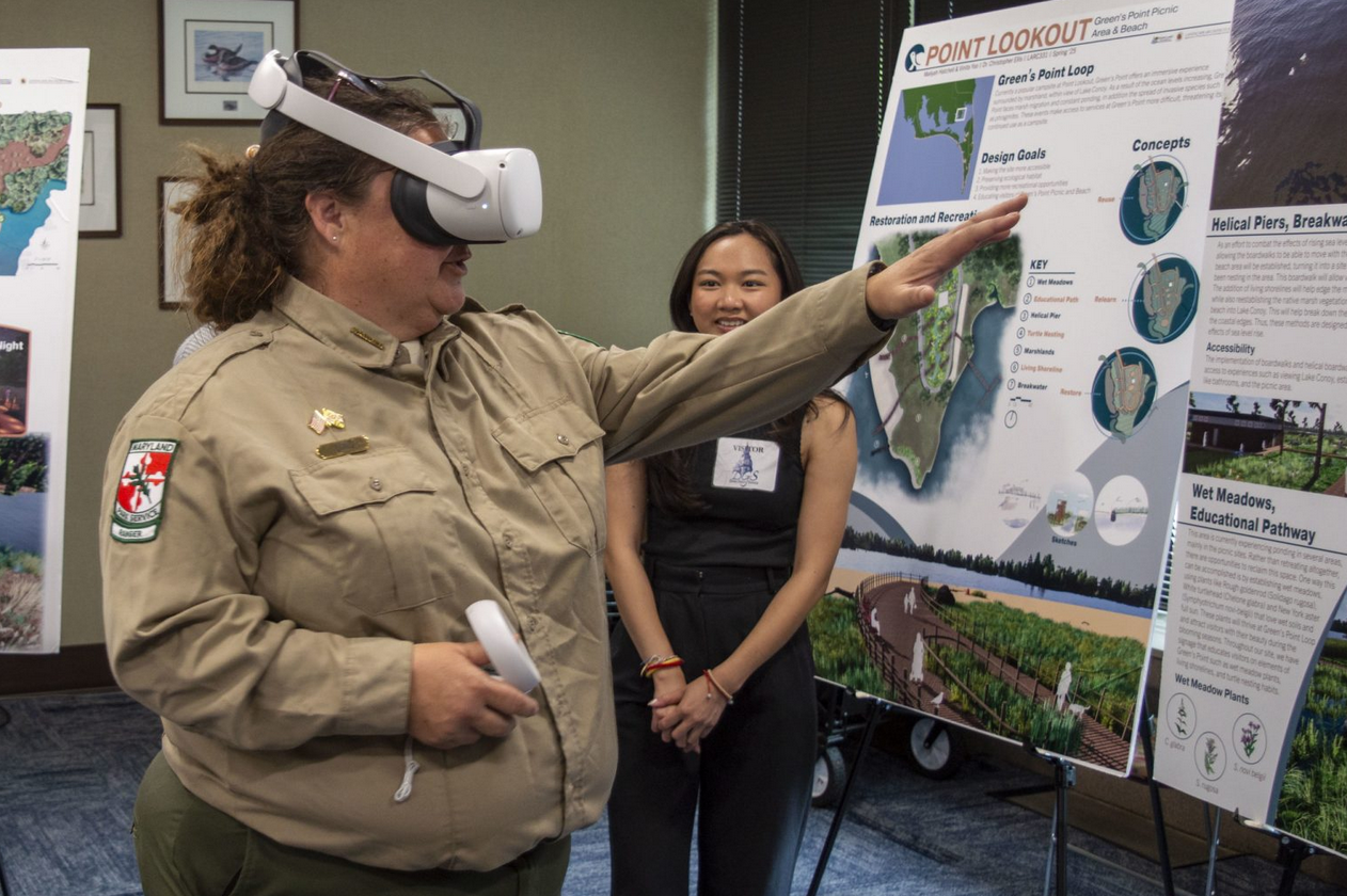 Woman waearing a virtual reality headset and visualizing climate change solutions